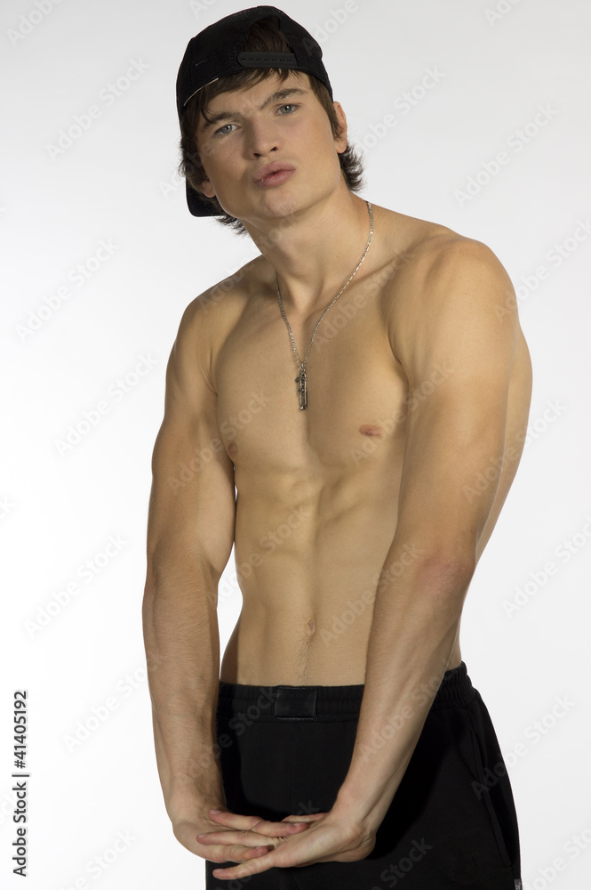 Fototapeta premium Naked waist young athlete with sporty cap