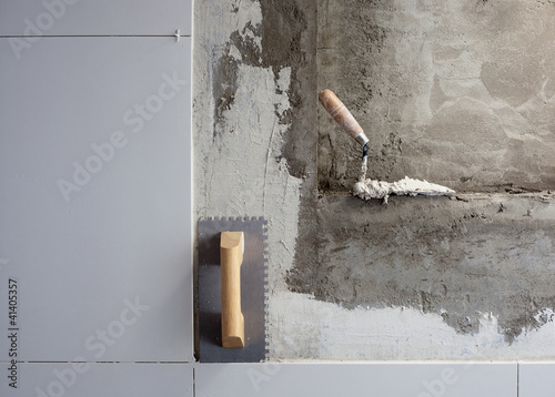 construction tools notched trowel with mortar photo