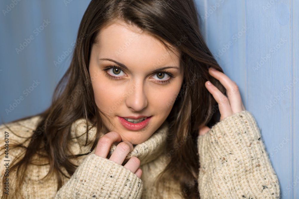 Smiling winter brunette woman in beige sweater Smiling winter brunette woman in beige sweater