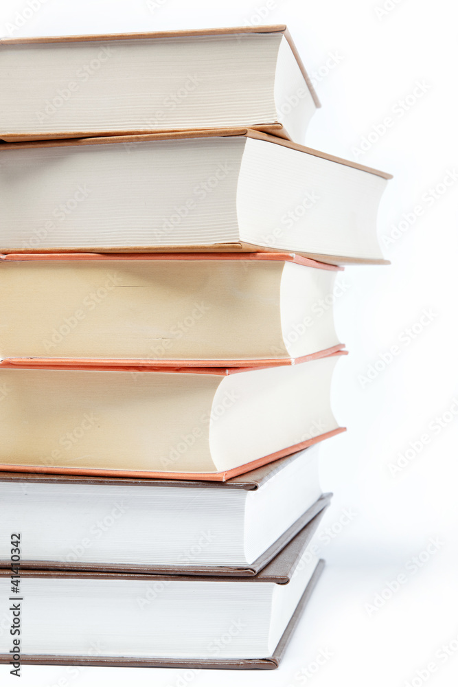 A stack of books on a white background. A stack of books on a white background.