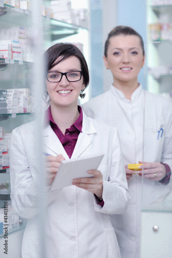team of pharmacist chemist woman in pharmacy drugstore team of pharmacist chemist woman in pharmacy drugstore
