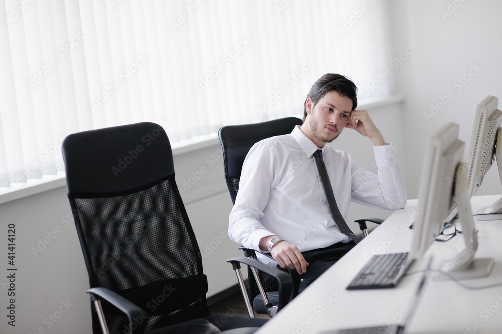 tired and depresed young business man at office tired and depresed young business man at office
