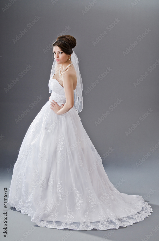 Bride in wedding dress in studio shooting Bride in wedding dress in studio shooting