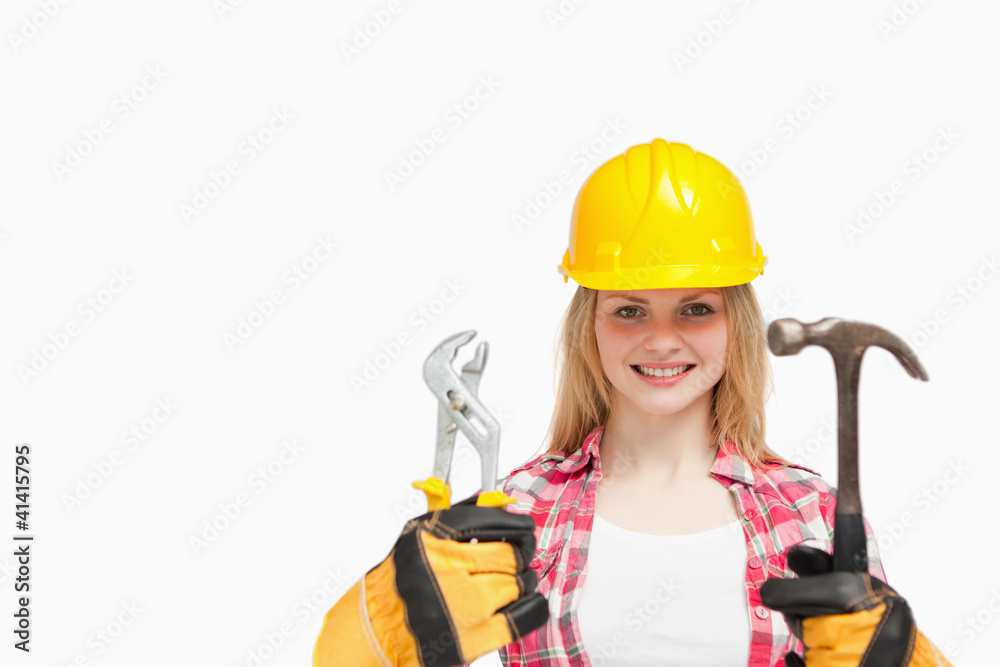 Woman smiling while wearing a safety helmet Woman smiling while wearing a safety helmet