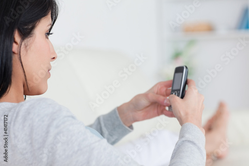 Woman typing on a phone