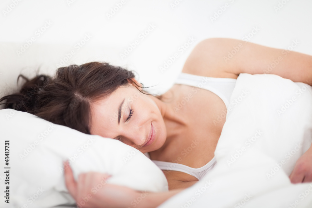 Peaceful brunette woman sleeping late in the morning Peaceful brunette woman sleeping late in the morning
