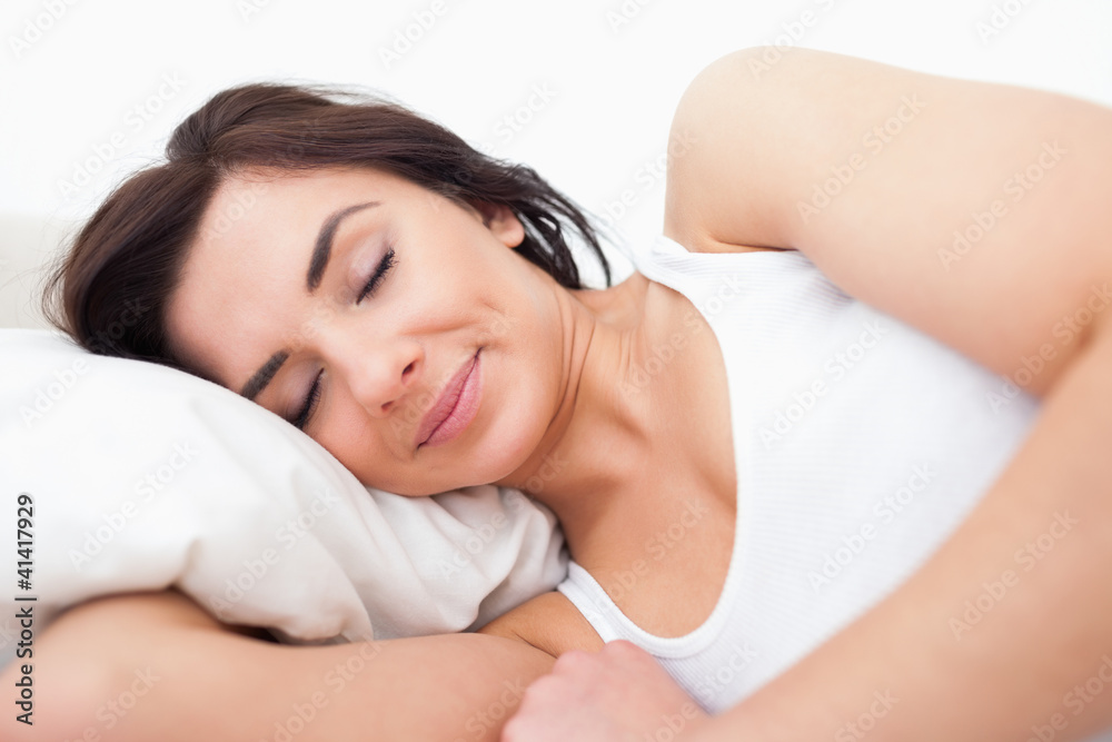 Peaceful woman lying while sleeping in the morning Peaceful woman lying while sleeping in the morning