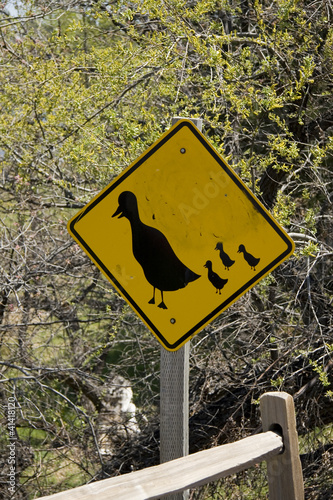 Ducks crossing yellow road sign