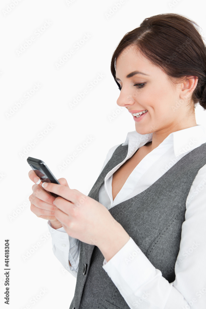 Attractive businesswoman text-messaging Attractive businesswoman text-messaging