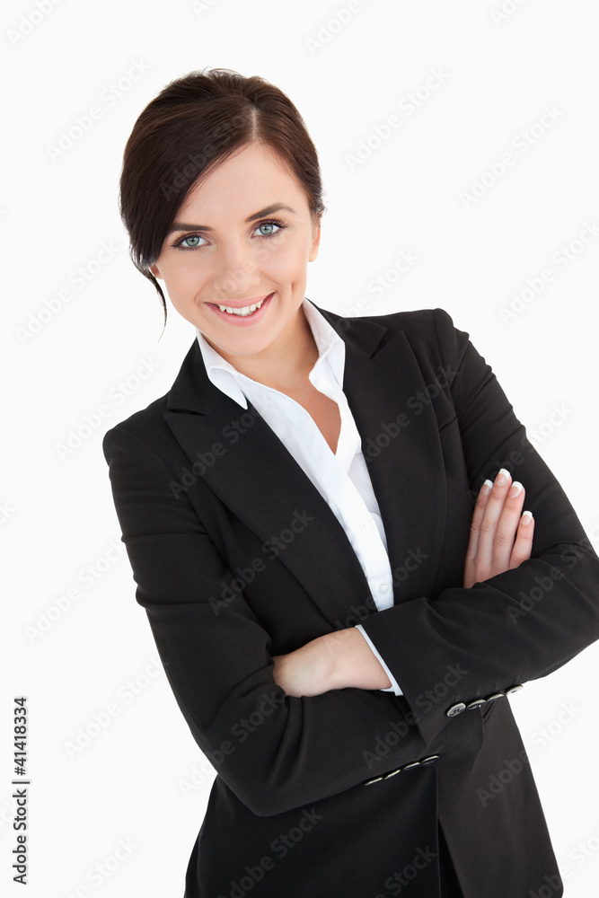 Smiling blue eyed woman in suit with arms folded Smiling blue eyed woman in suit with arms folded