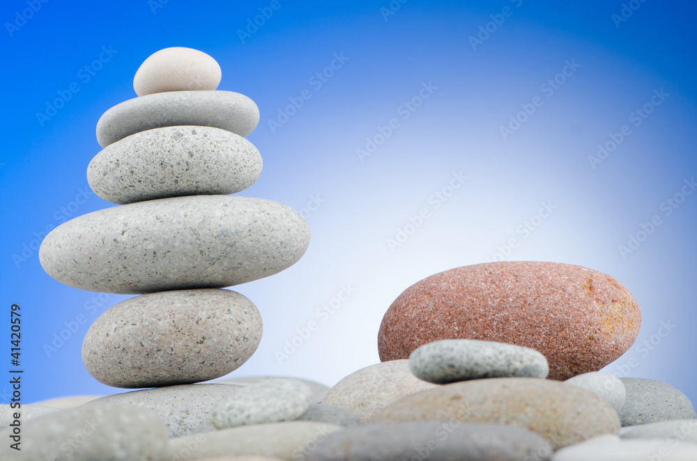 Pebbles stack against gradient background Pebbles stack against gradient background