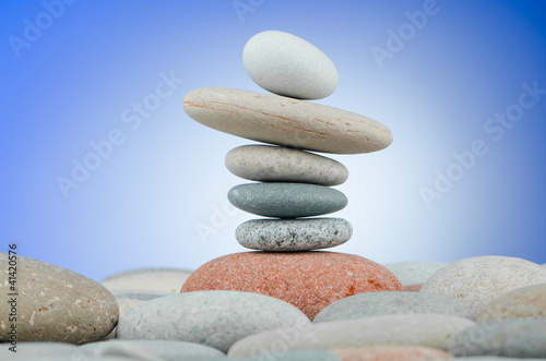 Pebbles stack against gradient background