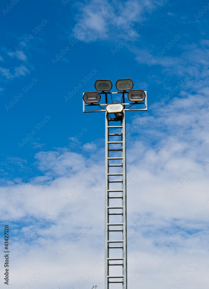 tower of spot-light or flood light against bright blue sky tower of spot-light or flood light against bright blue sky