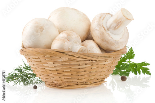 mushrooms and basket with spices isolated on white
