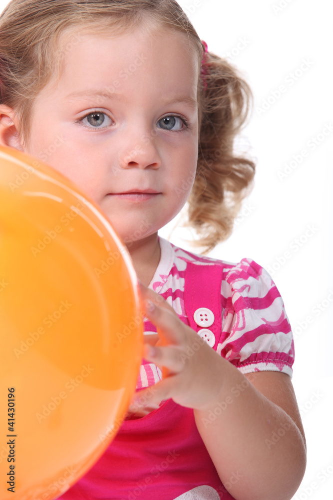 Little girl holding a balloon Little girl holding a balloon