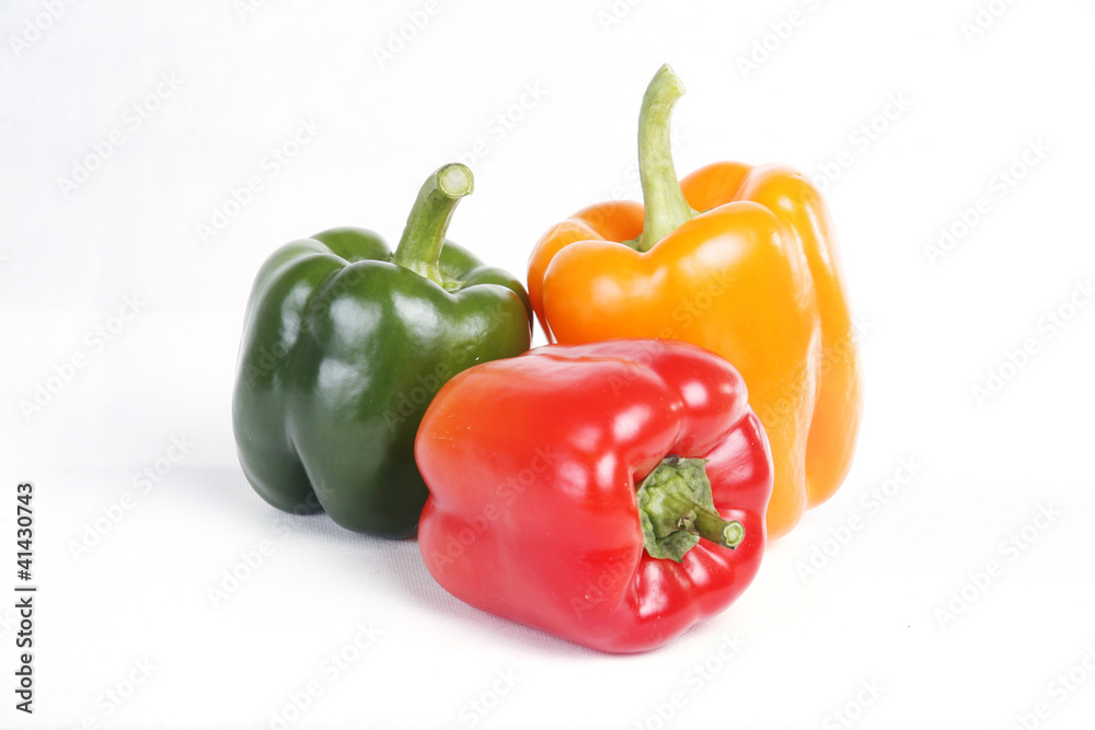 Three color red yellow green peppers in white background Three color red yellow green peppers in white background