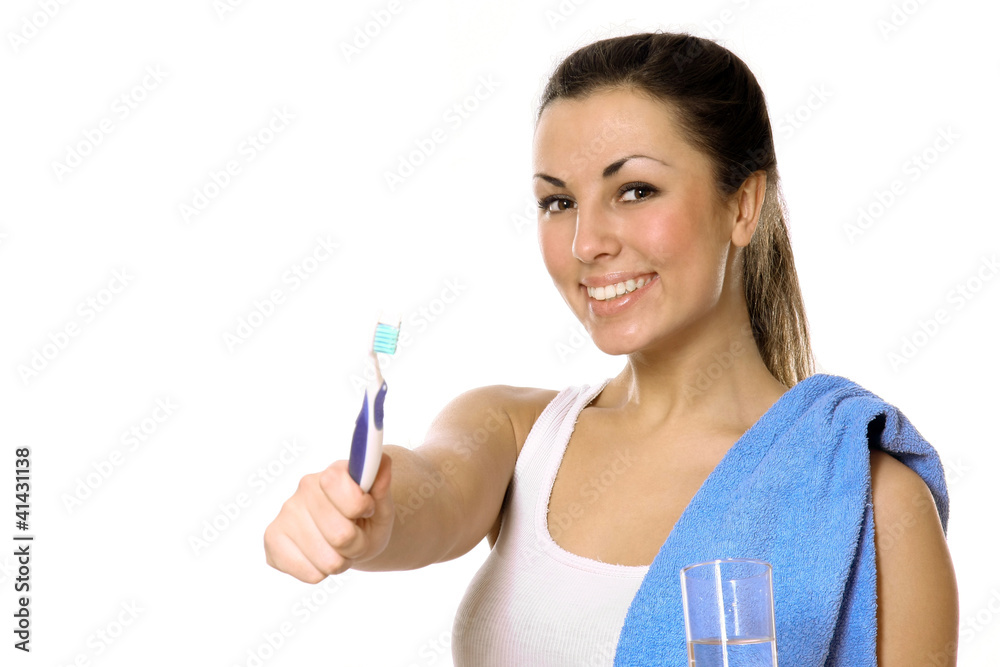 Young woman holding tooth brush isolated on white background Young woman holding tooth brush isolated on white background