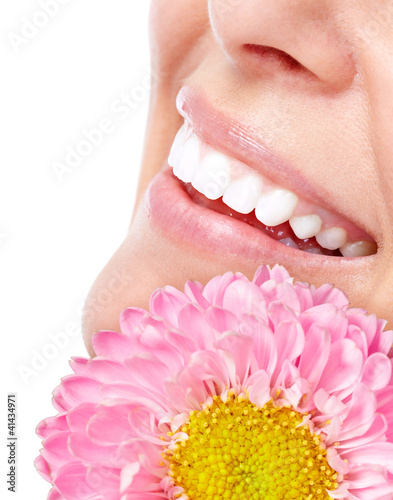 Beautiful woman face with flower. photo