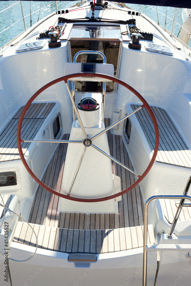boat stern with big steering wheel sailboat