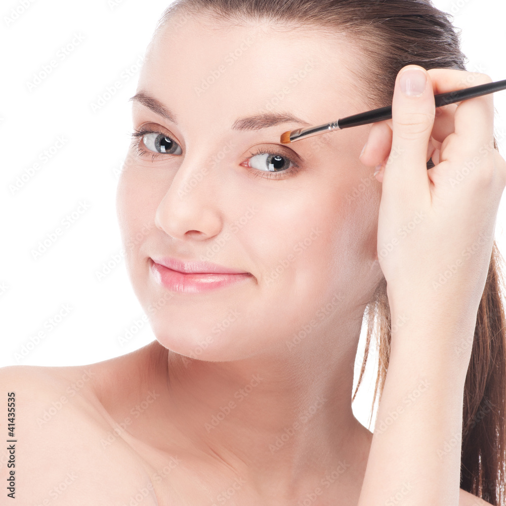 Beautiful woman with make up brush Beautiful woman with make up brush