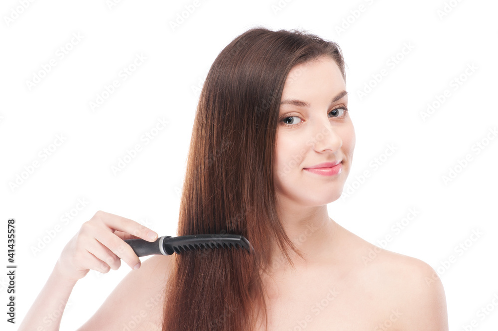 Fototapeta premium Beautiful woman with hair brush
