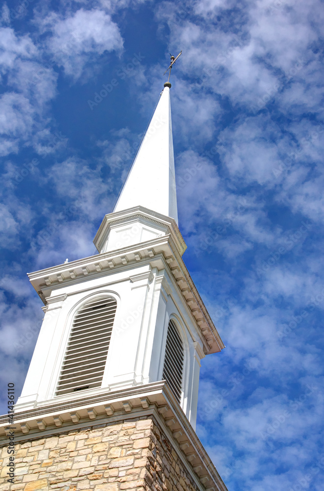 Church Steeple with cloudy skies in the background