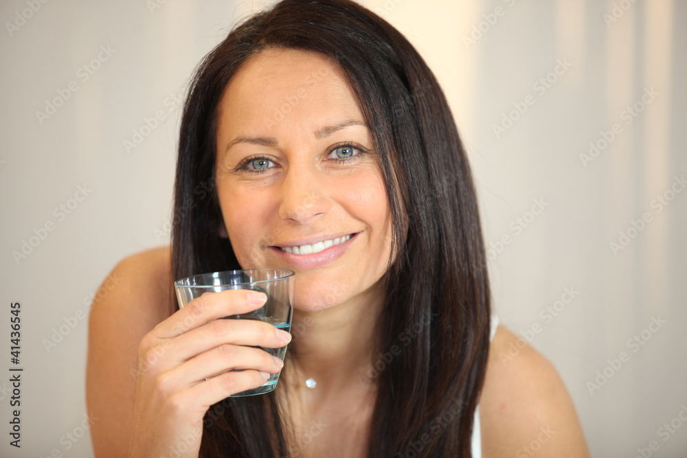 Brunette woman with glass of water Brunette woman with glass of water
