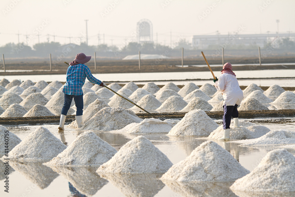 Salt fields with piled up sea salt in Thailand Salt fields with piled up sea salt in Thailand