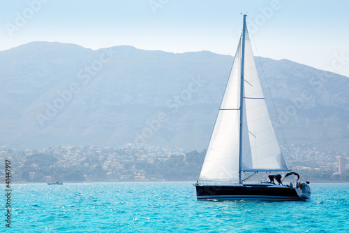 sailboats sailing in mediterranean sea