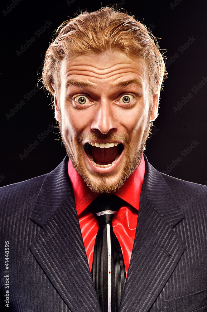 portrait of young man shouting portrait of young man shouting