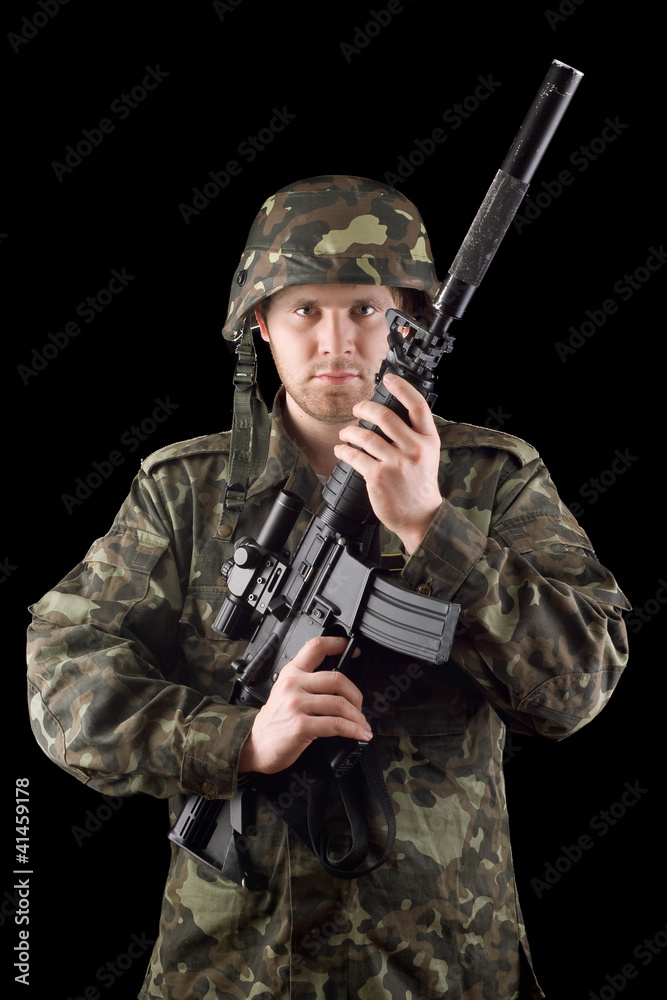Alerted soldier raised m16 in studio