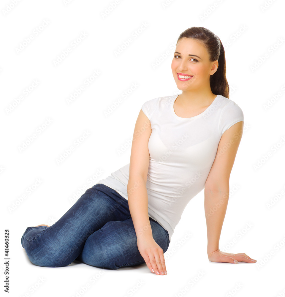 Young woman sitting on the floor Young woman sitting on the floor