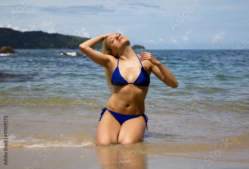 Beautiful blonde sunbathing on the beach