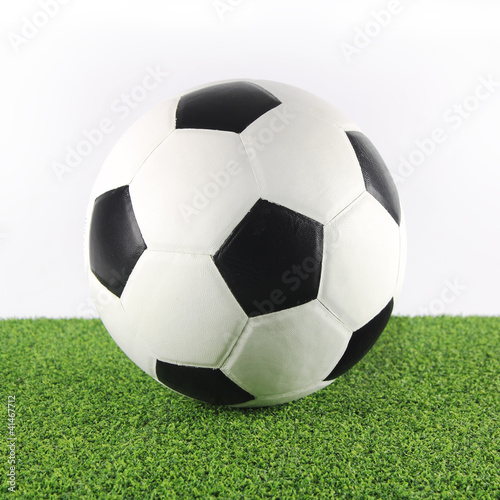 Soccer ball on soccer field background