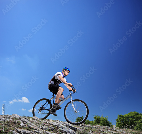 A man riding a mountain bike on a slope
