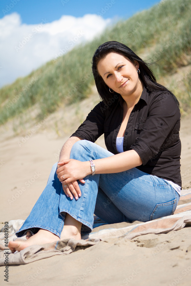 Beautiful brunette portrait on summer beach
