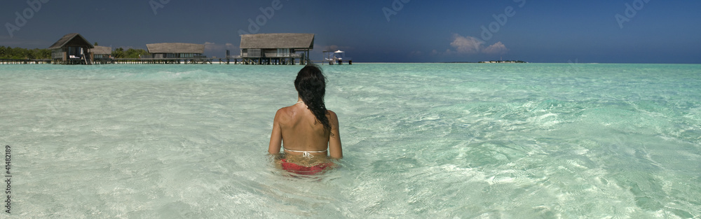 Lady relaxing in a maldivian lagoon