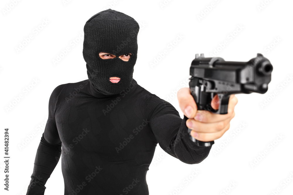 A view of a man with robbery mask holding a gun A view of a man with robbery mask holding a gun