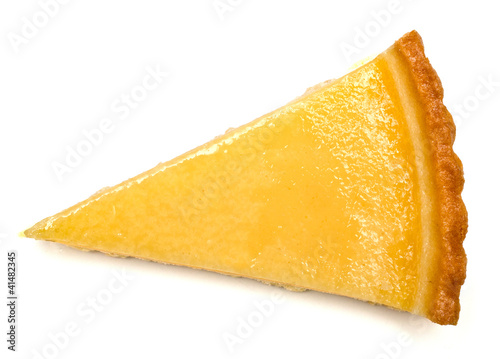 Delicious slice of tarte au citron (lemon tart) on white