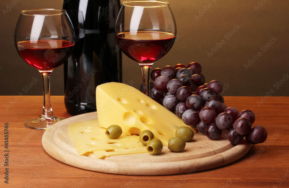 Bottle of great wine with wineglasses and cheese