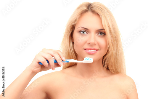 Attractive young woman with a toothbrush