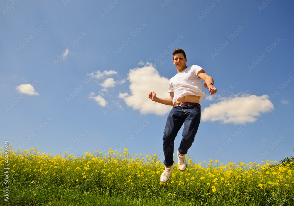 Energetic, young businessman jumping in air, great success Energetic, young businessman jumping in air, great success