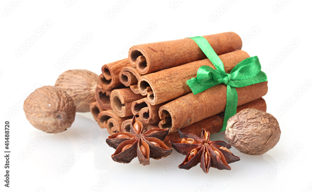Cinnamon sticks, nutmeg and anise isolated on white Cinnamon sticks, nutmeg and anise isolated on white