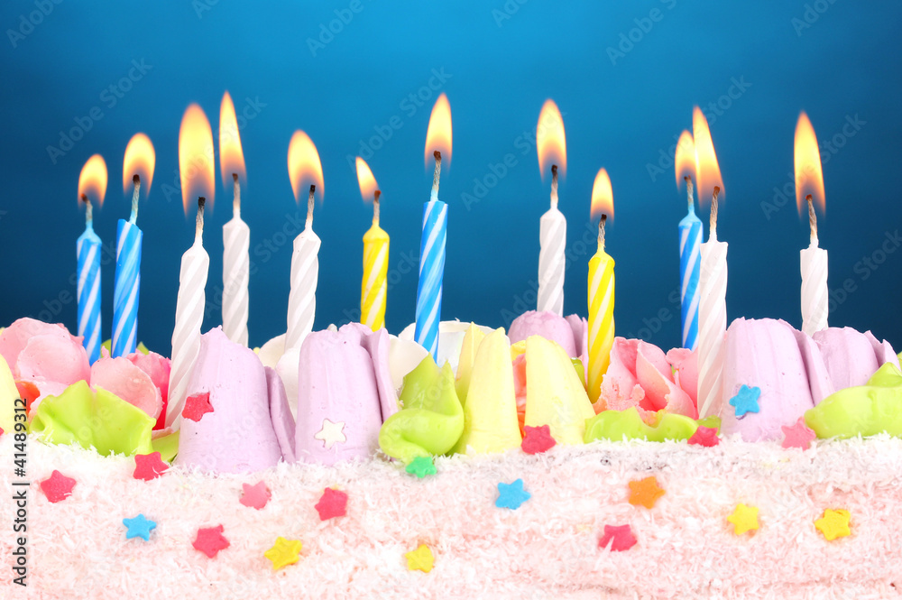 Birthday cake with candles on blue background Birthday cake with candles on blue background