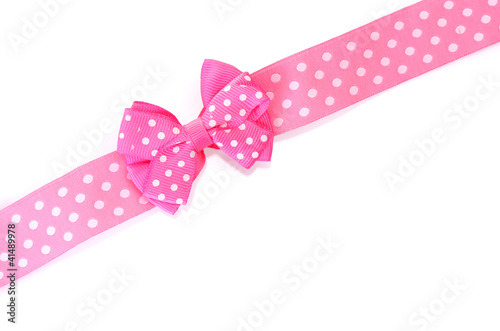 beautiful pink bow and ribbon isolated on white.