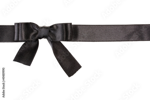 black bow on ribbon isolated on white.