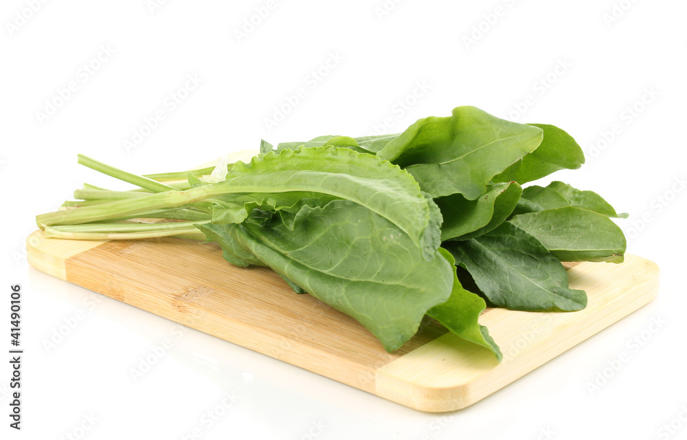 Fresh sorrel on wooden board isolated on white Fresh sorrel on wooden board isolated on white