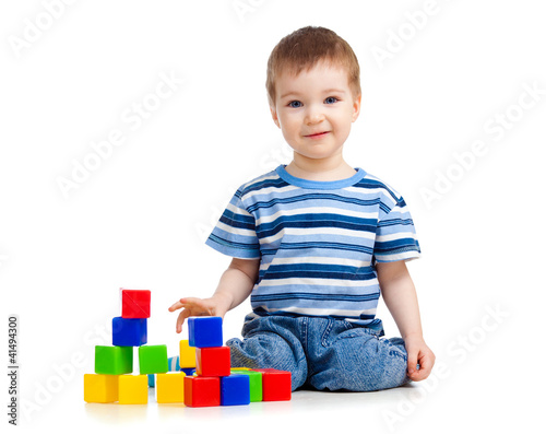 kid playing toy blocks and ...