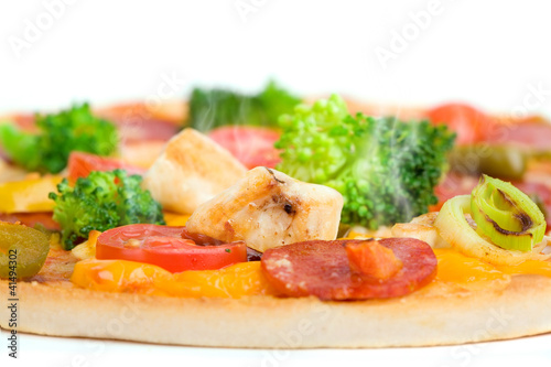 Close-up of fresh pizza with chicken and broccoli
