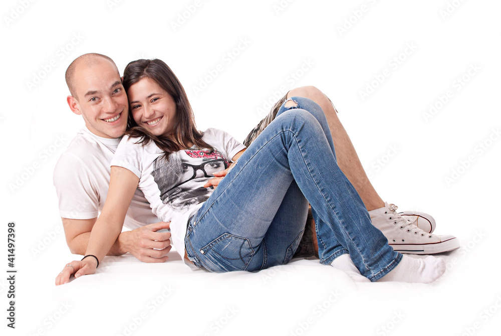 Happy couple isolated on the floor Happy couple isolated on the floor